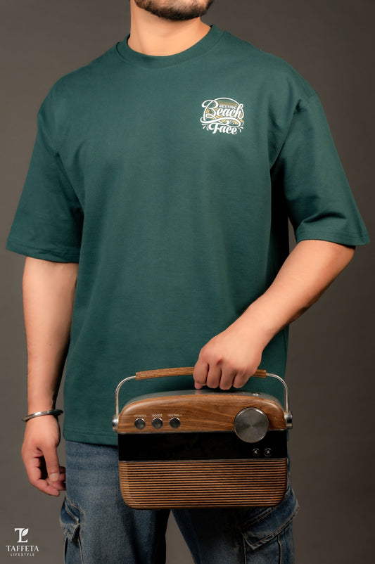 Emerald “Resting Beach Face” Oversized Tee.